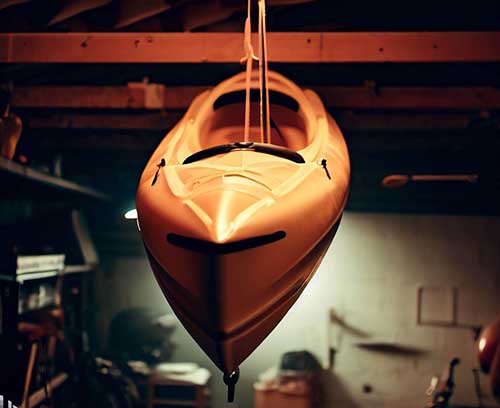 kayak hanging from garage ceiling