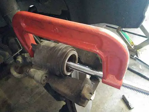 Use 6 inch G-Clamp to push in brake caliper ram