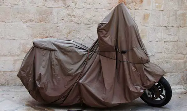 DIY motorcycle cover made out of bed sheets or ground tarps