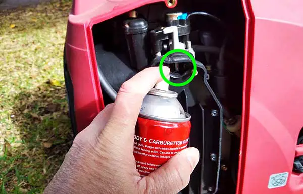 Where to spray starter fluid on small engines?